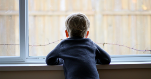 Child looking out of window doing the memory test activity