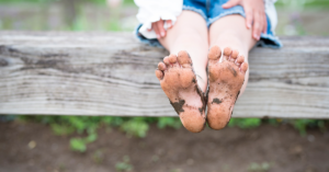 Child with muddy feet